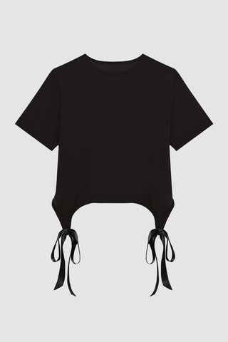 The Diana Satin Bow Shirt - Black is a black short-sleeve crop top with satin bow details at the sides, perfect for spring, displayed against a white background.