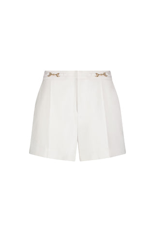 The Ellery Horsebit Short - White features front pleats and signature gold horsebit hardware on the waistband, expertly tailored and displayed against a plain white background.