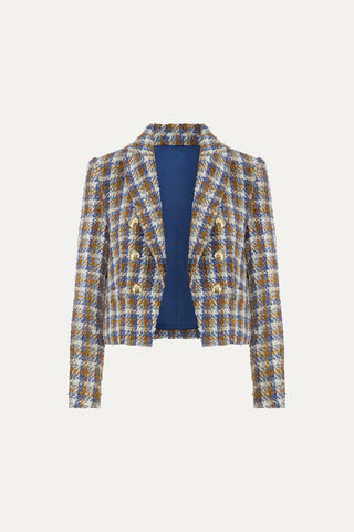 The Gabrielle Tweed Double Breasted Blazer - Coastal Multi is a cropped, plaid Chanel-inspired blazer with gold buttons, a blue, yellow, and white checkered pattern, deep blue lining, and a structured silhouette.