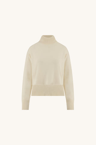 Gia Sweater in Pearl flat lay, ivory oversized turtleneck sweater on a cream background