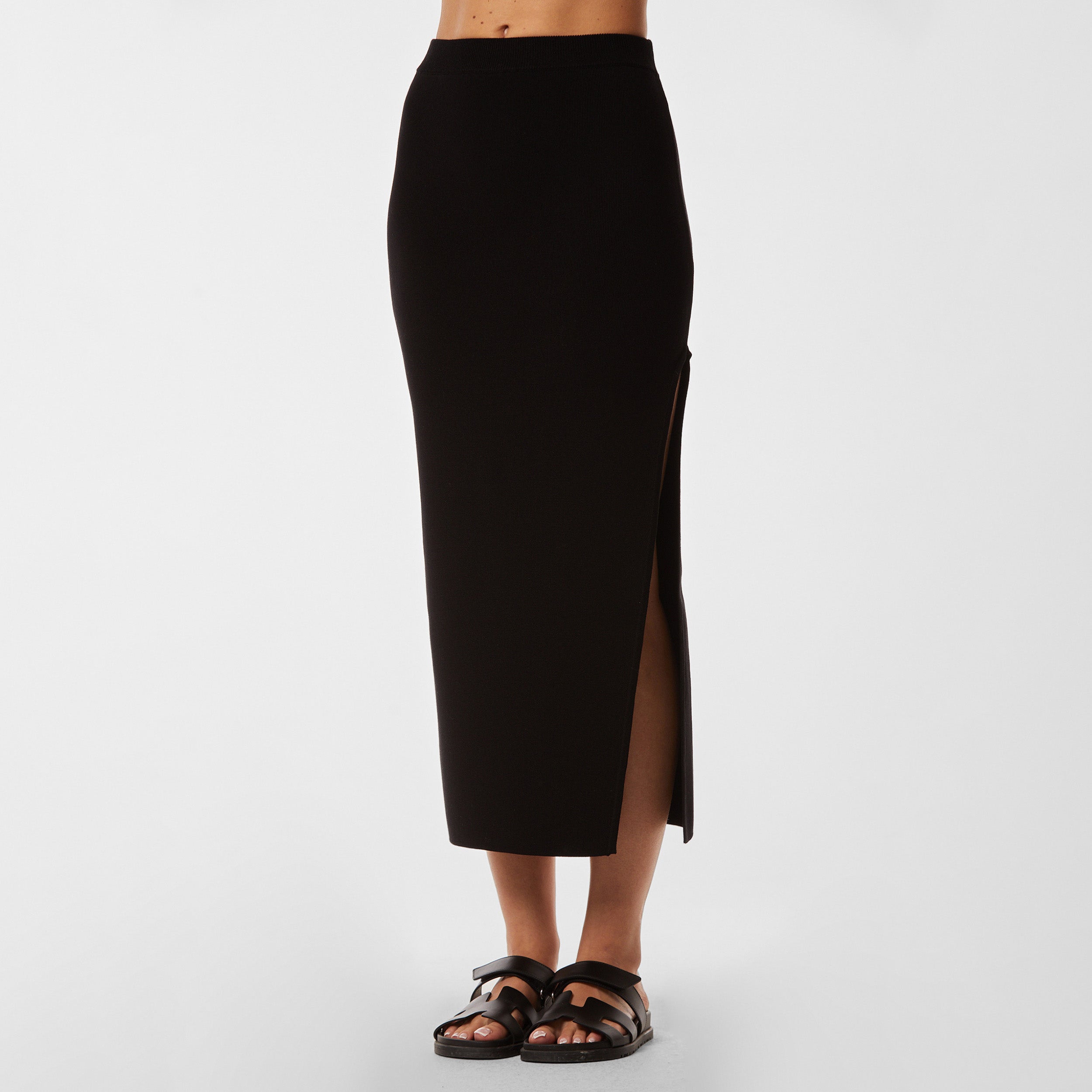 Front view of Black midi skirt with side slit