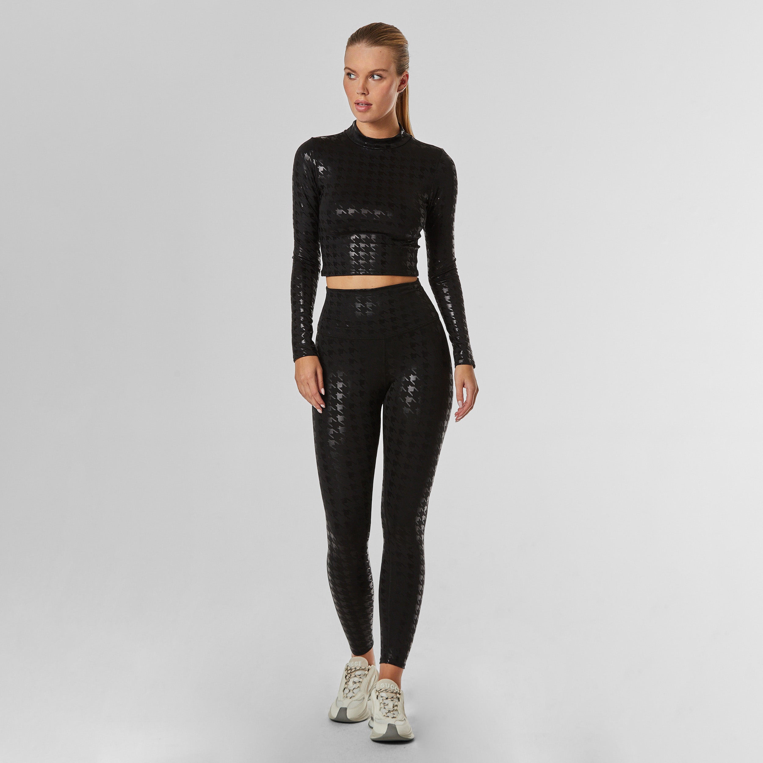Full body view of black on black houndstooth Long Sleeve top and matching legging