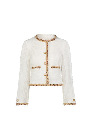 The Joane Tweed Jacket - Pearl Multi is a chic lady jacket with a white textured design, pearl statement buttons, tan fringe trim, round neckline, long sleeves, cropped fit, and two front pockets.