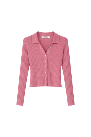 The Karolina Polo Shirt in Petal Pink features long sleeves, a ribbed lightweight knit, a collar, and diamond buttons down the front, shown on a white background.