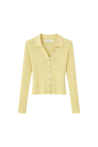 The Karolina Polo Shirt in sunshine yellow is a lightweight, long-sleeve ribbed knit with a collar and front button closure—an effortless spring staple, shown on a white background.