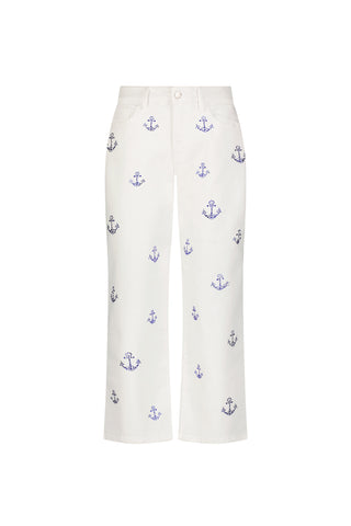 The Kelsey Cropped Jean - Crystal Anchors features a high-rise fit with small blue embroidered anchors and subtle crystal anchor accents on white denim.