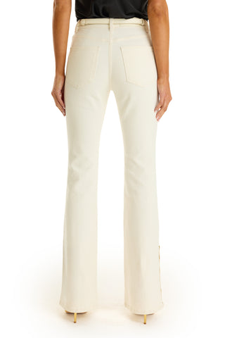 A person is shown from the back wearing the Veronica Button Jean - Ivory, high-waisted flared pants that elongate the legs, paired with a black top and beige heels against a white background.