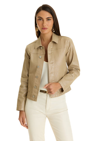 A woman with long dark hair models the Joelle Jean Jacket in Champagne over a white top and cream pants, paired with large gold earrings, against a plain white background.