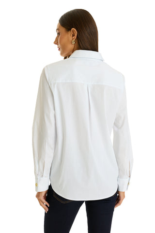 A woman with straight brown hair is shown from the back wearing the Jasmine Shirt - White, featuring a pleated back yoke, paired with dark jeans against a white background.