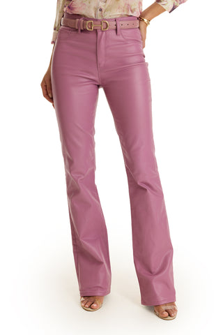 A person wears the Aria Coated Flare Jean in mauve with a matching belt and open-toed shoes, shown from the waist down against a white background.