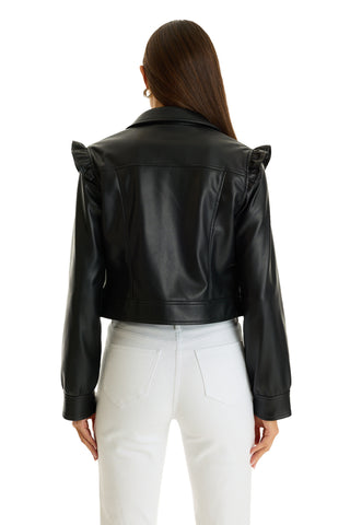 A woman with long brown hair wears the Chantal Ruffle Sleeve Leather Jacket in black with white jeans, shown from behind against a white background—a chic fall statement piece.