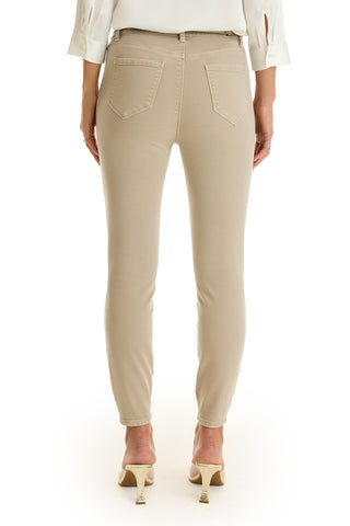 A person shown from the back wears the Nina Cropped Skinny Jean in Oatmeal with a white top and white high heels, standing against a white background.