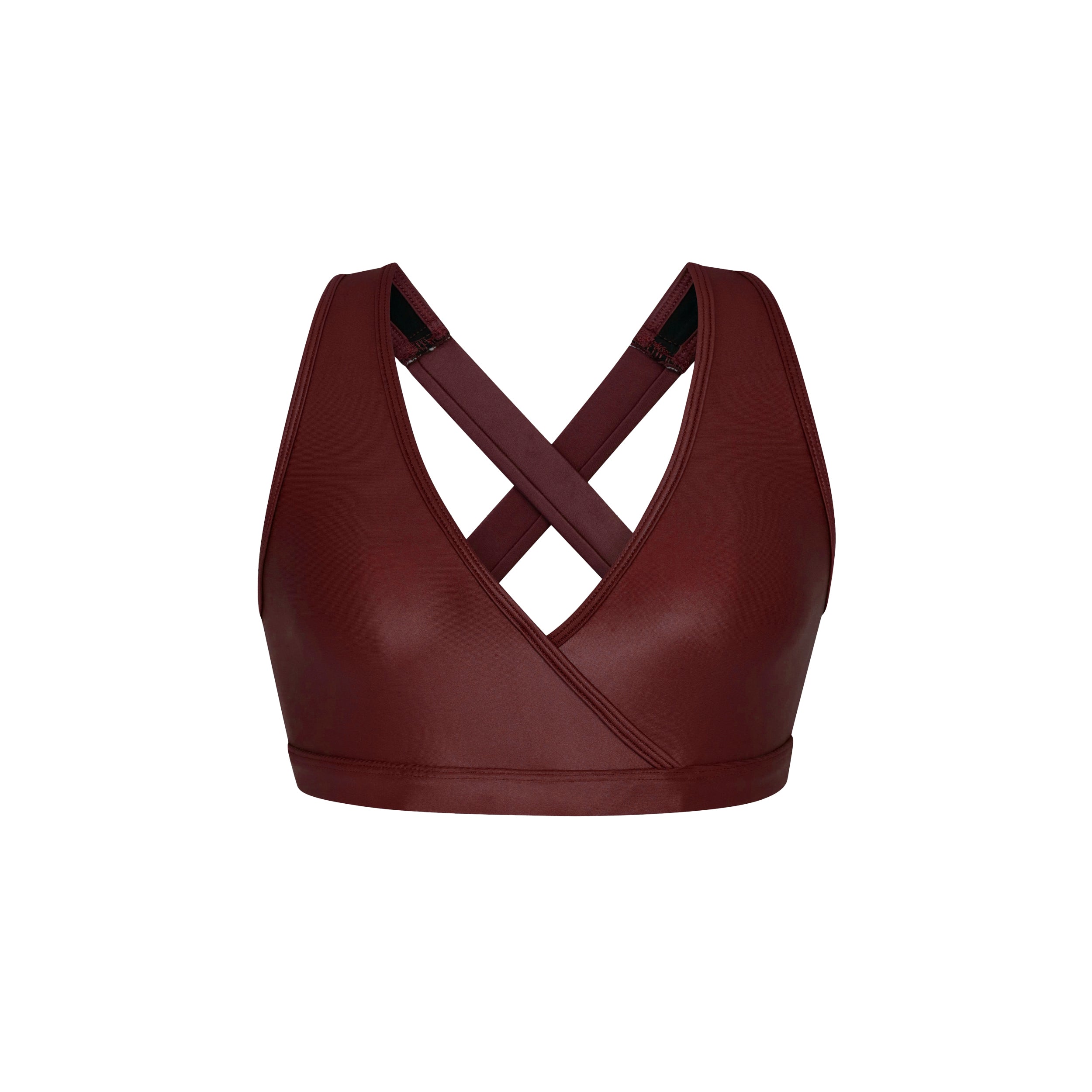 Product view of woman wearing sleek and supportive dark red colored v-neck bra features lightweight and lustrous shine.