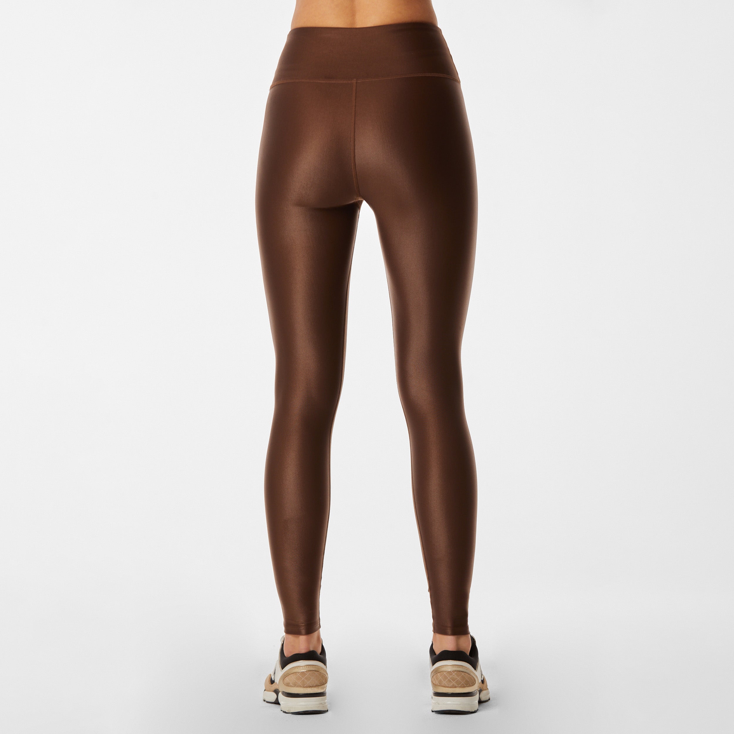 Rear view of lightweight, lustrous shine, quick drying brown liquid leggings