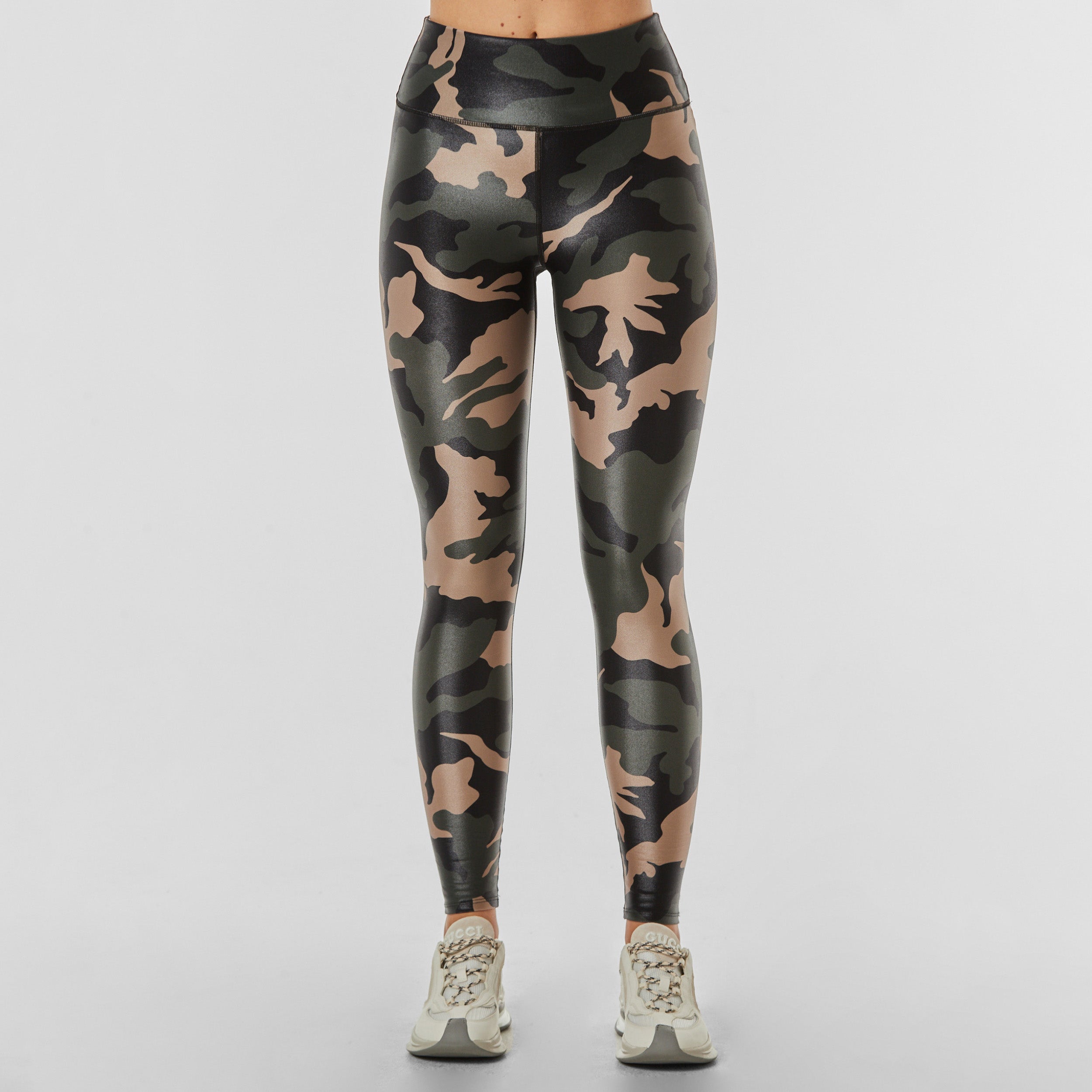 Front view of woman wearing lightweight, lustrous shine, quick drying camo printed liquid leggings