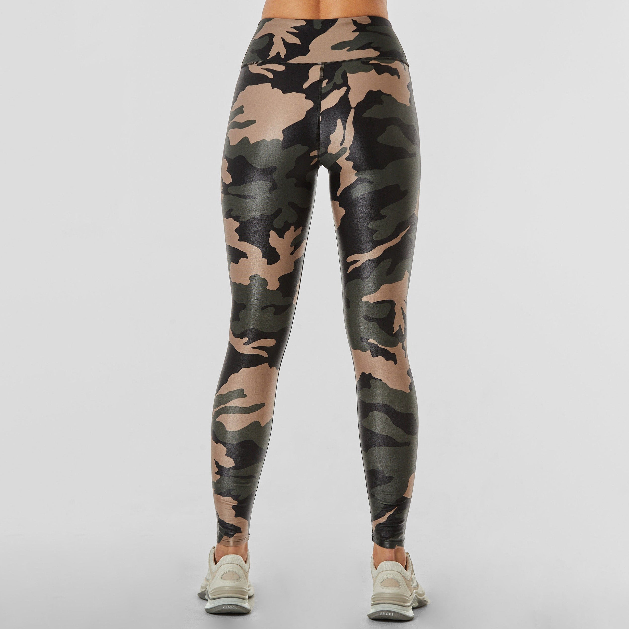 Rear view of woman wearing lightweight, lustrous shine, quick drying camo printed liquid leggings