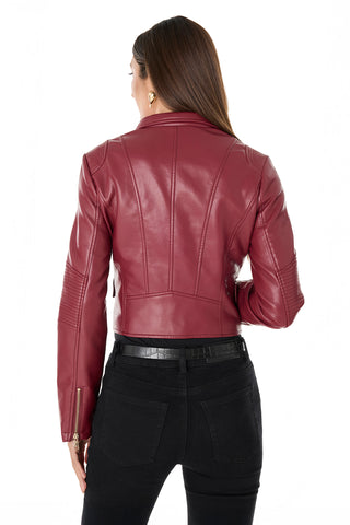 A woman with long brown hair is shown from the back, wearing the chic Katalina Moto Jacket - Merlot with black jeans and a black belt, standing against a plain white background.