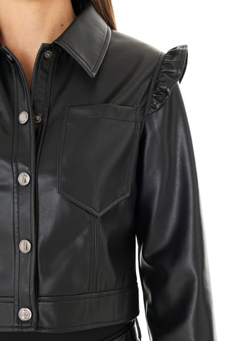 A close-up of the Chantal Ruffle Sleeve Leather Jacket - Black, featuring silver buttons, a chest pocket, wide collar, and ruffle shoulder detail. This chic fall piece is styled on someone with long brown hair.
