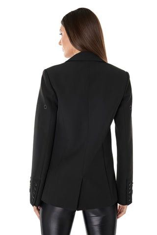 A woman with straight brown hair is seen from the back in the London Floral Sequin Blazer - Black, featuring buttoned sleeves, paired with black leather pants for a polished, modern look against a plain white background.