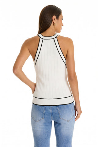 A woman with straight brown hair is seen from the back wearing the Martha Button Halter Tank in white, featuring black trim, paired with light blue jeans against a plain white background.
