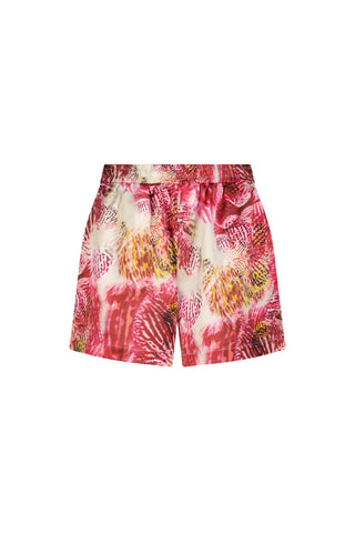 The Nora Silk Short in Bright Orchid features a pink, yellow, and white abstract floral print with a tropical vibe, relaxed fit, and waistband, displayed on a white background.