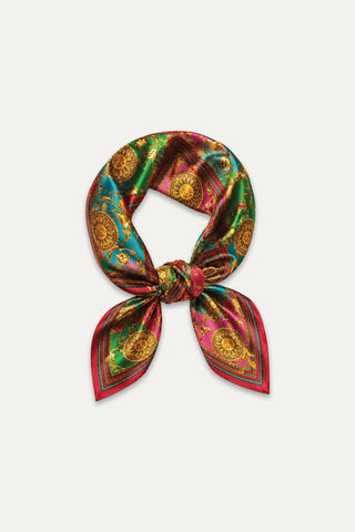 Printed Satin Scarf - Dolce Sun: A luxurious satin scarf with vibrant green, red, and gold baroque sun medallion patterns, center-knotted and displayed on white—an elegant statement accessory.