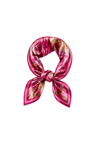 The Printed Satin Scarf - Bright Orchid features a vibrant abstract orchid print in pink, styled in a neat knot with pointed ends, and is displayed on a plain white background.