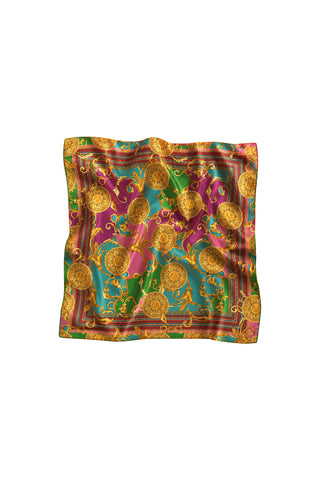 The Printed Satin Scarf - Dolce Sun is a square silky scarf with an ornate gold baroque print, sun medallions, and green, pink, and blue panels, finished with intricate gold borders.