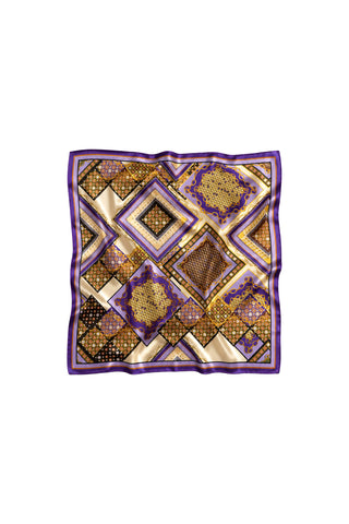 The Printed Satin Scarf - Riviera Chain showcases an intricate gold, purple, and black geometric diamond and floral pattern with a purple border, elegantly displayed on a white background.