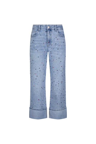 The Ren Cropped Cuff Jean - Confetti features light blue, four-way stretch denim with a relaxed fit, multicolored paint splatters, classic five-pocket style, and wide rolled cuffs for all-day comfort.
