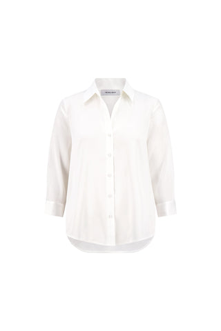 The Sara Silk Blouse - White is a relaxed-fit, three-quarter sleeve button-down shirt with a collar and classic high-low hem, shown on a plain white background.