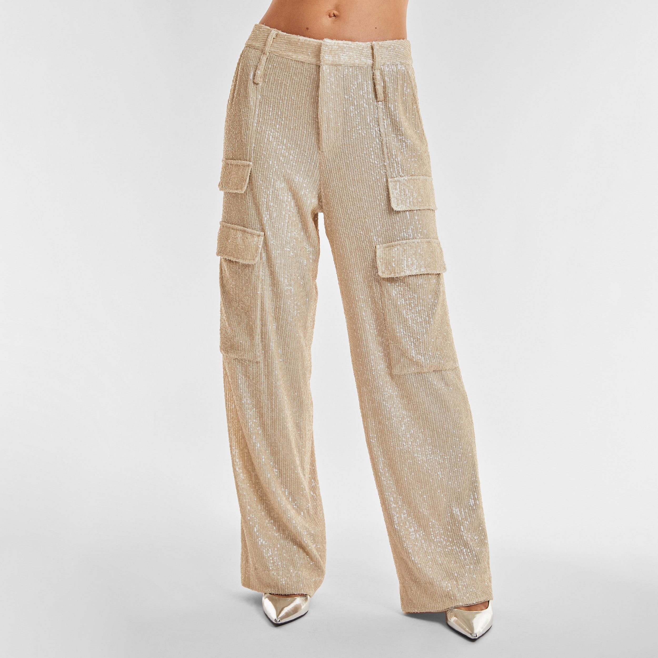 Front view of woman wearing Pearl Sequin Cargo Pant featuring Mid-rise with side pockets and cargo detail. 