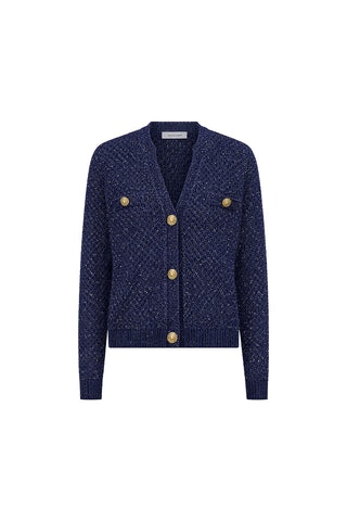 The Shannon Sequin Cardigan Top in navy features a textured knit, gold front buttons, two buttoned chest pockets, and ribbed hem and cuffs—a classic cardigan shown on a plain white background.