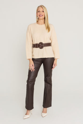 Ingrid Sweater in Latte full-length look, latte rib-knit sweater belted in espresso with espresso coated flare jeans and ivory heels