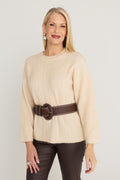 Ingrid Sweater in Latte, a wide-rib crewneck knit, front view belted with the Biarritz Belt in Espresso over the Aria Coated Flare Jean in Espresso