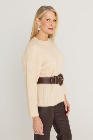 Ingrid Sweater in Latte side view showing the dropped shoulder and relaxed fit, belted with the Biarritz Belt in Espresso