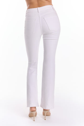 A woman is shown from the back in Allegra Bootcut Jean - White, paired with beige high-heeled shoes, against a plain white background.