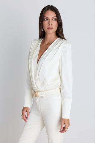 Detail of the Frances Silk Bodysuit in pearl showing the tailored cuffs and V-neckline