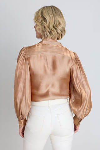 Back view of the Colette Blouse - Champagne showing the puffed sleeve silhouette