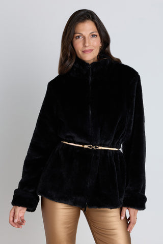 The Antonia Belted Fur Jacket in Black, a plush faux fur jacket with a self-tie belt, worn by a model