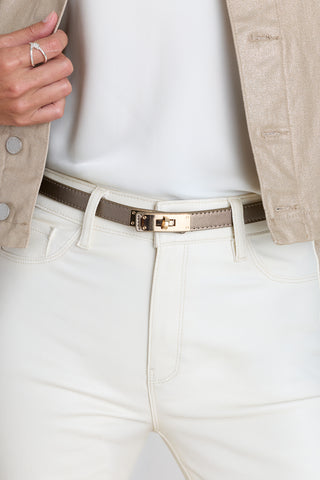 The Nicola Belt in Bronze styled at the waist showing the gold lock closure