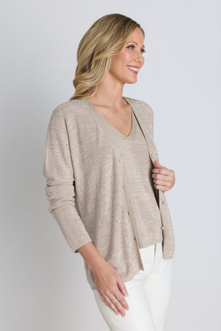 Detail of the Carrie Crystal Cardigan in beige showing the front buttons and shimmer texture