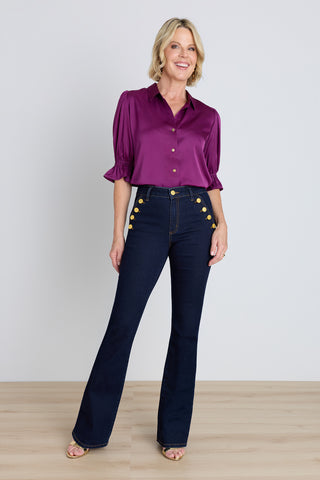 Allegra Bootcut Jean - Indigo styled view showing the flared silhouette and vintage gold buttons