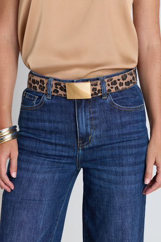 The Bianca Belt in leopard worn at the waist, showing the suede leopard print and gold buckle