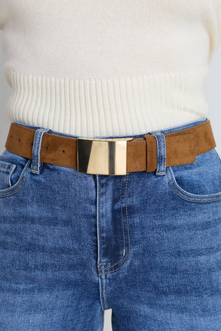 The Bianca Belt in chestnut suede worn at the waist, showing the wide strap and gold buckle