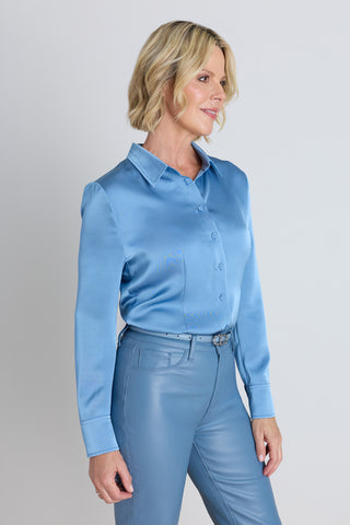 Detail of the Paulina Silk Blouse in coastal blue showing the buttoned cuffs