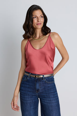 The Yara Silk Camisole in rosewood, a coral satin cami with a V-neck and adjustable straps