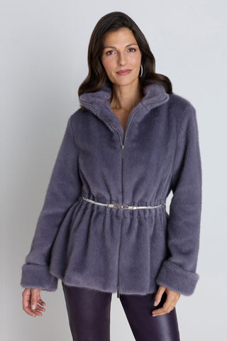 The Antonia Belted Fur Jacket in Lavender, a plush faux fur jacket with a self-tie belt, worn by a model