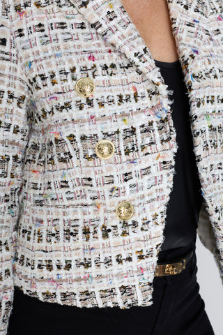 Detail of the Gabrielle Tweed Blazer in ecru multi showing the multicolor woven texture