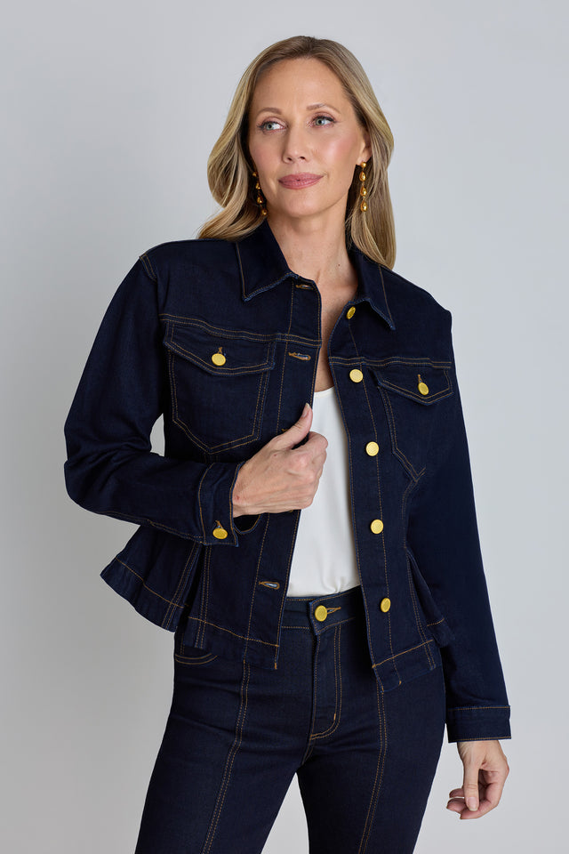 The Bethanie Denim Jacket in indigo, a peplum-hem denim jacket with gold buttons and chest flap pockets